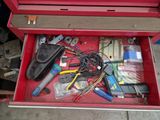 a red tool box filled with assorted electrical tools