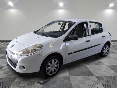 a picture of a white car parked in a garage
