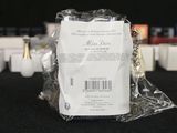 a package of perfumes on a table with a black background