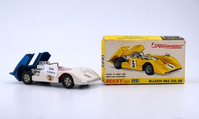 a small toy car next to a box of toys