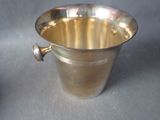 a silver cup that is sitting on a table