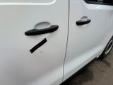 a close up of a car door handle with a sticker on it