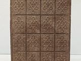 antique cast iron door mat with a cross design
