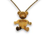 une photo d'un collier avec un ours en peluche en or suspendu à une chaîne