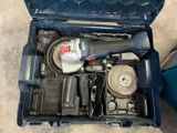 a tool box with tools in it sitting on the floor