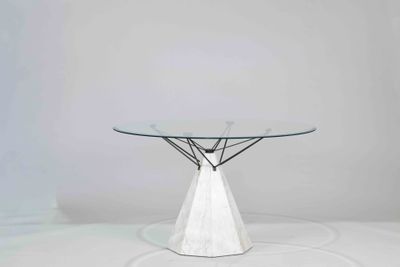 a white table with a glass top on a white surface