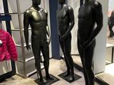 three mannequins that are on display in a store