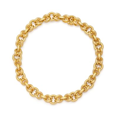a gold chain bracelet on a white background