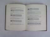an open book with music notes on it on a table