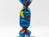 a blue vase sitting on top of a black base