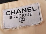 chanel boutique label on a beige jacket