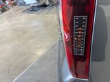 a sticker on the tail light of a car