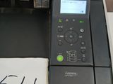 an image of a printer with a sign on the side of it