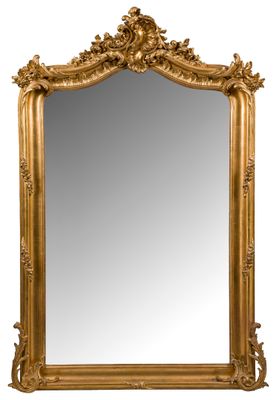 un miroir à cadre doré orné d’un motif décoratif