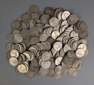 a pile of silver coins sitting on a table