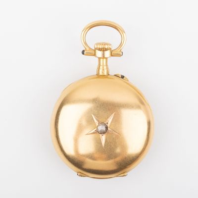an image of a gold pocket watch with a diamond in the center