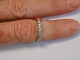 a close up of a person ' s hand with a ring on it