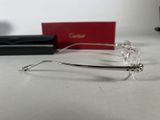 a pair of glasses sitting on a table next to a pair of glasses