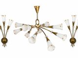 a set of three brass and glass sconces on a white background