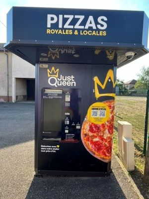 un distributeur automatique sur lequel est représentée une pizza