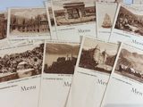 a lot of old postcards that are on a table
