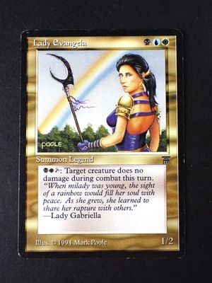 a close up of a card with a picture of a woman holding a scythe