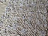 a close up of a table with a white doily on it