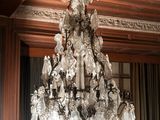 a chandelier hanging from the ceiling in a room