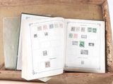 a open book with stamps in it sitting in a box
