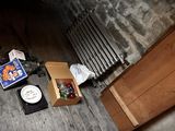 a box with a clock and some other items on the floor