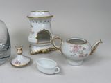 a glass vase, a teapot, a pitcher, and a tea pot