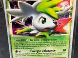 a close up of a pokemon card on a table