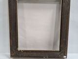 a close up of a picture frame on a white surface