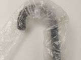 a plastic bag with a black object inside of it