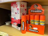 a shelf with a lot of toothpaste and toothbrushes on it