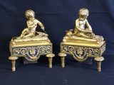 pair of antique brass figurines of a boy and a girl on a bench
