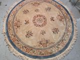 a round rug on the floor in the middle of the room