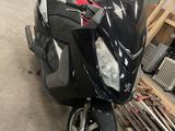 a scooter that is parked in a garage