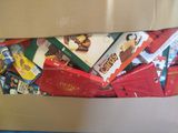 a cardboard box filled with assorted candy and candy bars