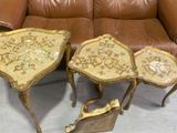two pieces of furniture are sitting on a couch in a room