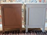 two nightstands sitting next to each other on a rug