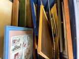 a blue container filled with books and pictures on the table