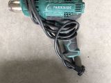 a close up of a corded drill with a cord attached to it