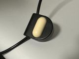 a close up of a black and white object on a white surface