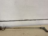 a metal object on the floor next to a white wall