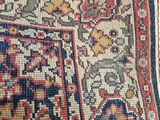 the rug is on the floor next to the chair