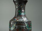 a vase that has a design on it on a table