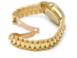a close up of a watch on a gold bracelet on a white background