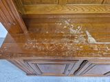 a picture of a wooden cabinet with peeling paint on it