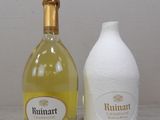 bottles of wine and a bottle of wine sitting on a table